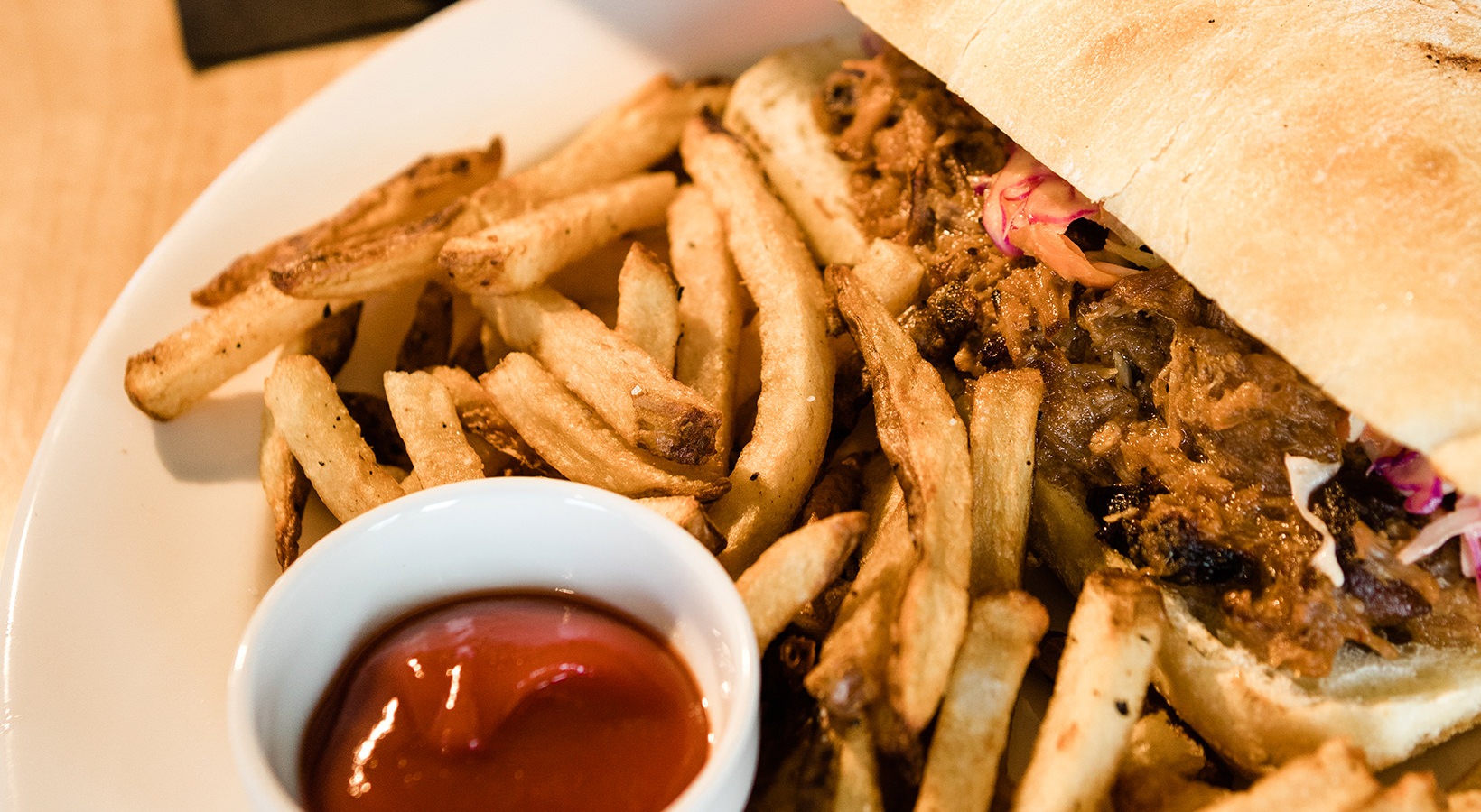 District Flats Lifestyle pulled pork sandwich with fries
